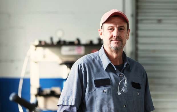 How John managed $113,000 in debt and protected his mechanic's workshop